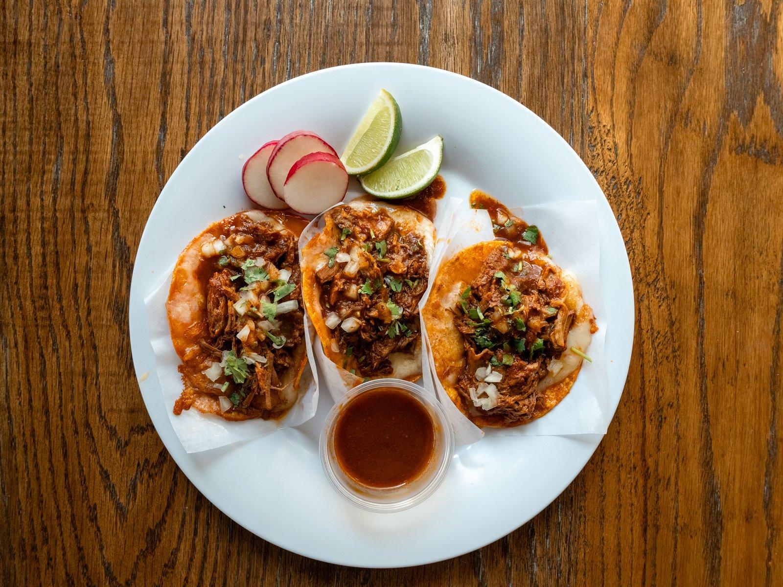 Red birria tacos with consommé