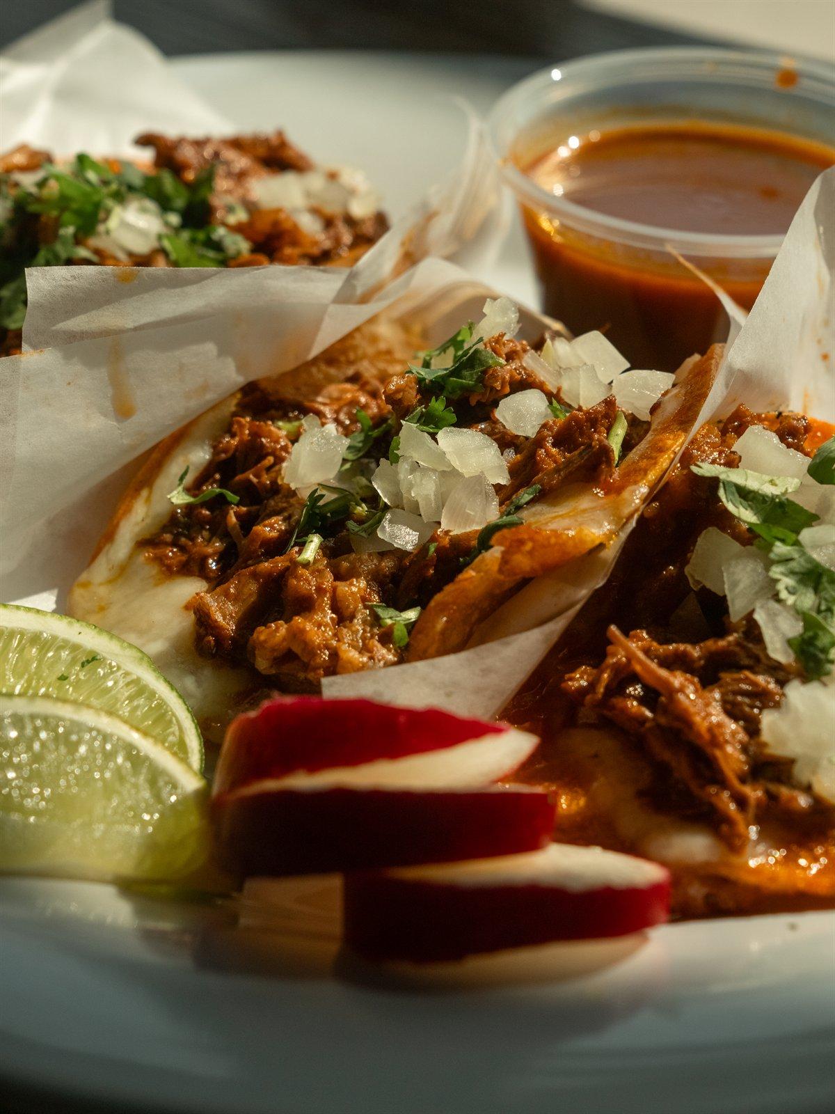 Red birria queso tacos with consomé